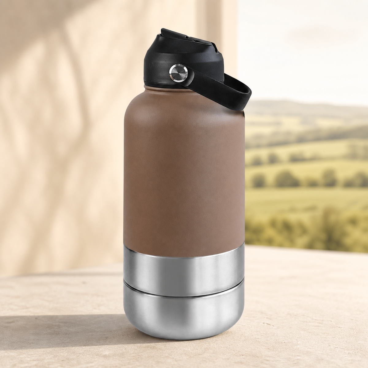 3-in-1 insulated dog travel water bottle in brown on a warm stone setting